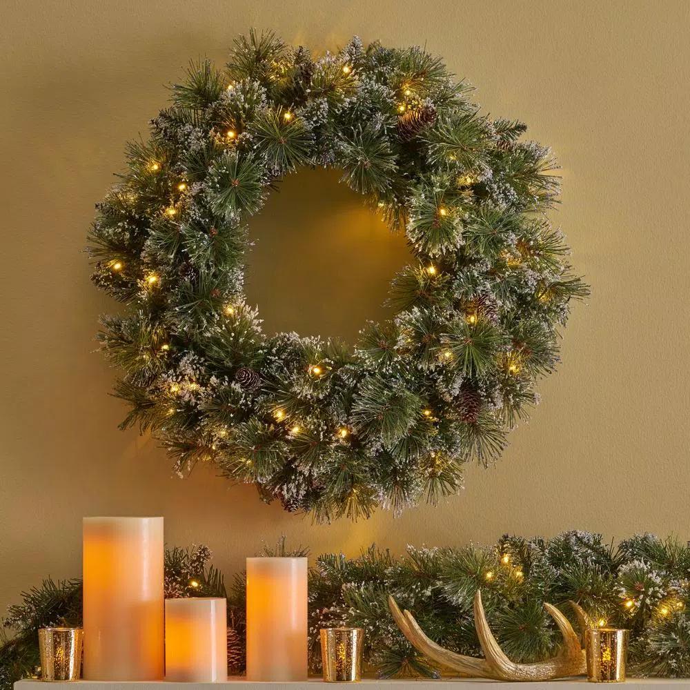 Noble House 24 in. Pre-Lit LED Artificial Christmas Wreath with Flocked Snow, Glitter, and Pinecones