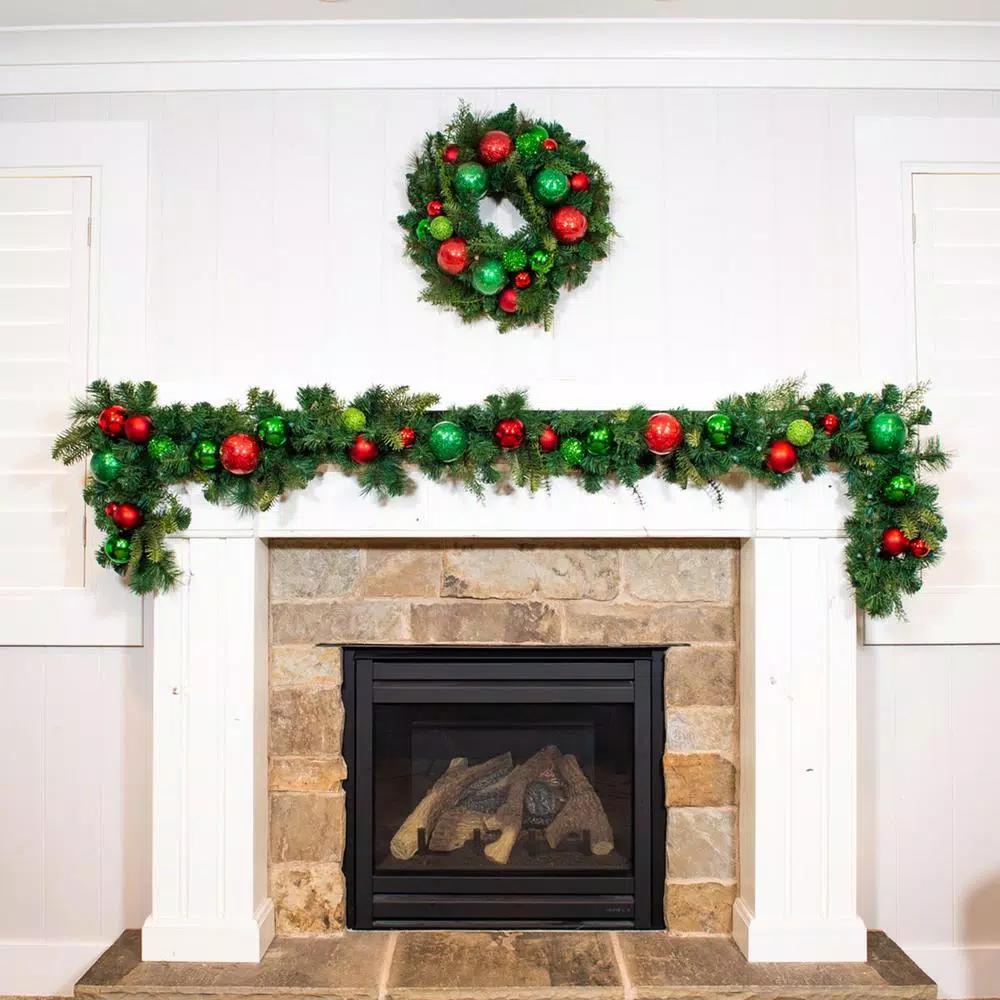 Village Lighting Company 24 in. Red and Green Christmas Cheer Artificial Pine Wreath with Ornaments