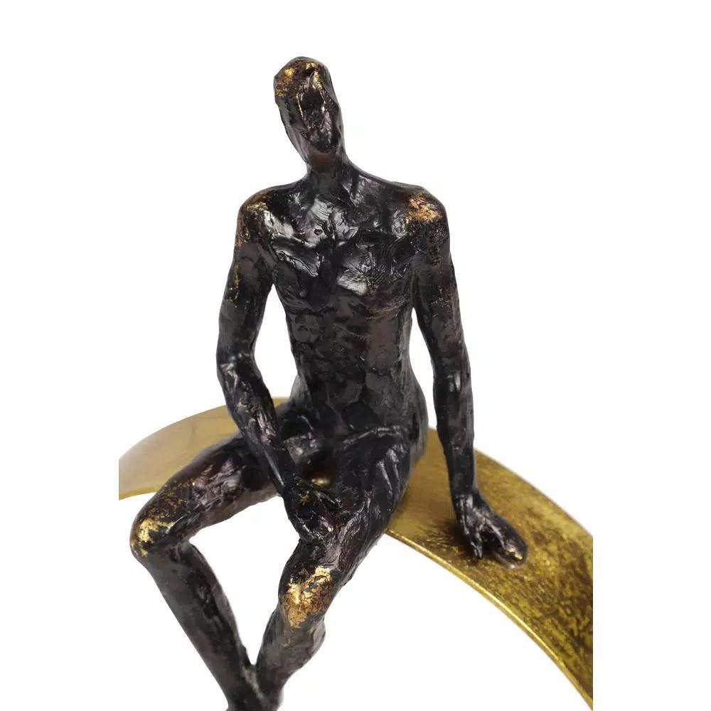 LITTON LANE Modern Textured Black Resin Man Figurine with Metallic Gold Circle Statue