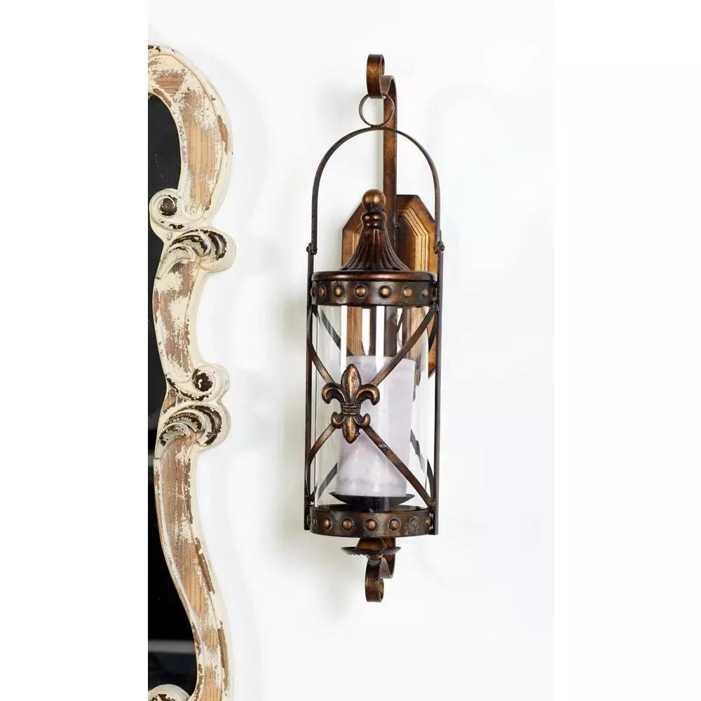 LITTON LANE Old World Riveted Burnished Bronze Iron Candle Sconce with Fleur-de-lis Motif