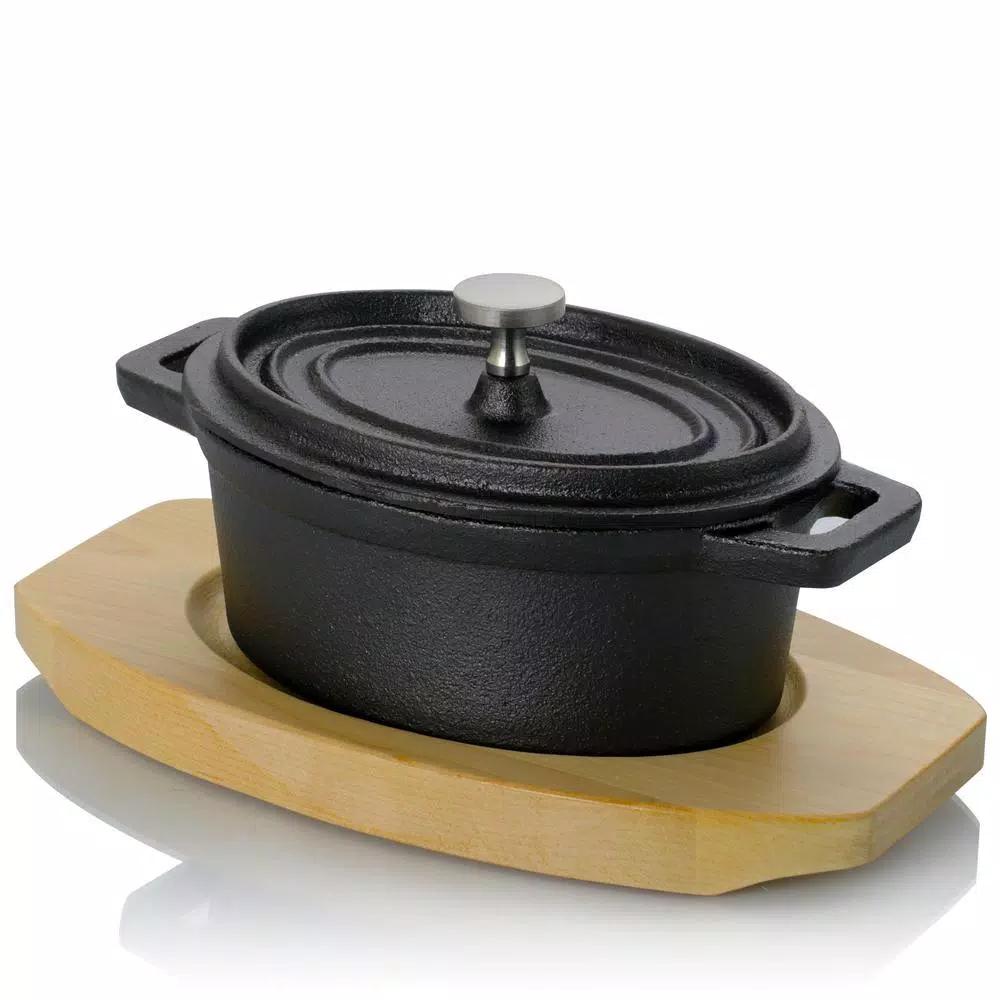 Gibson Home Campton 0.35 qt. Oval Cast Iron Mini Casserole Dish with Lid and Wood Base, Black