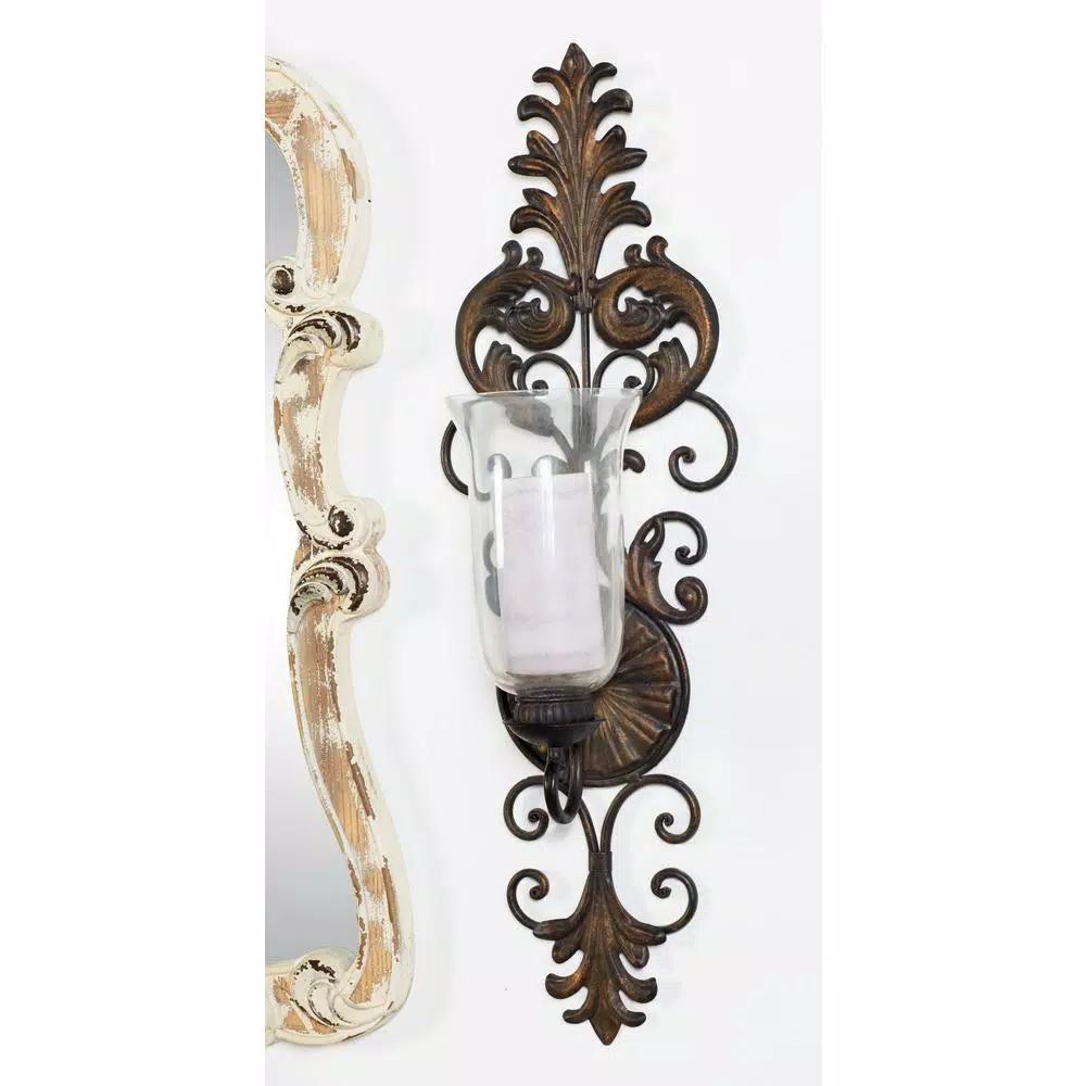 LITTON LANE Antique Gold Flourished Iron Candle Sconce with Clear Glass Hurricane Shade