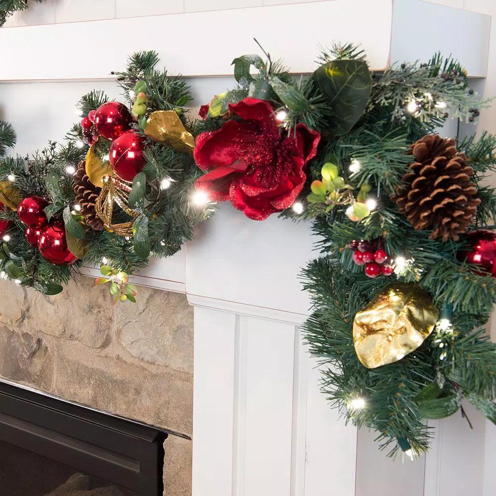 Village Lighting Company 9 ft. Pre-Lit Red Magnolia Christmas Garland with 100 LED Mini Lights
