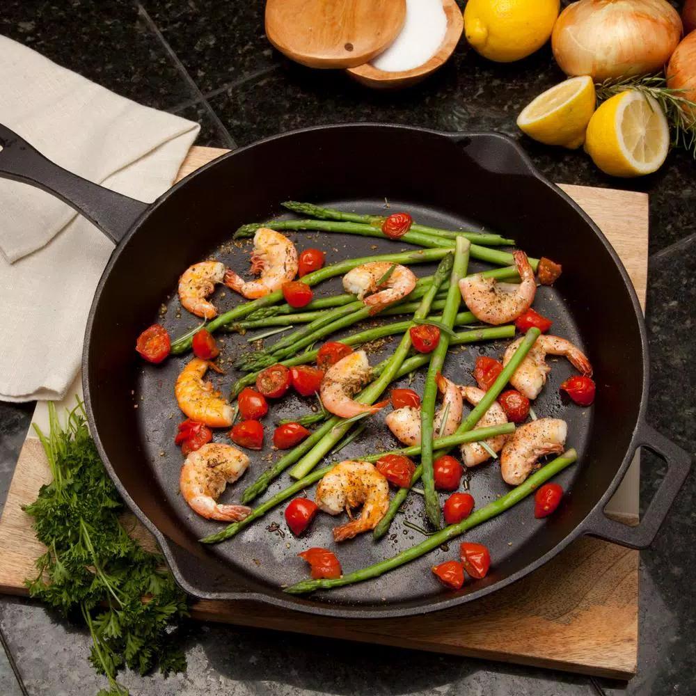 Bayou Classic 14 in. Pre-Seasoned Cast Iron Skillet with Pour Spouts and Helper Handle, Black