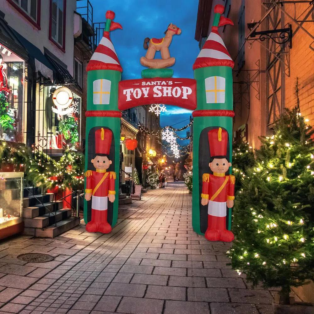Fraser Hill Farm 10 ft. Santa's Toy Shop Archway Inflatable with White Lights