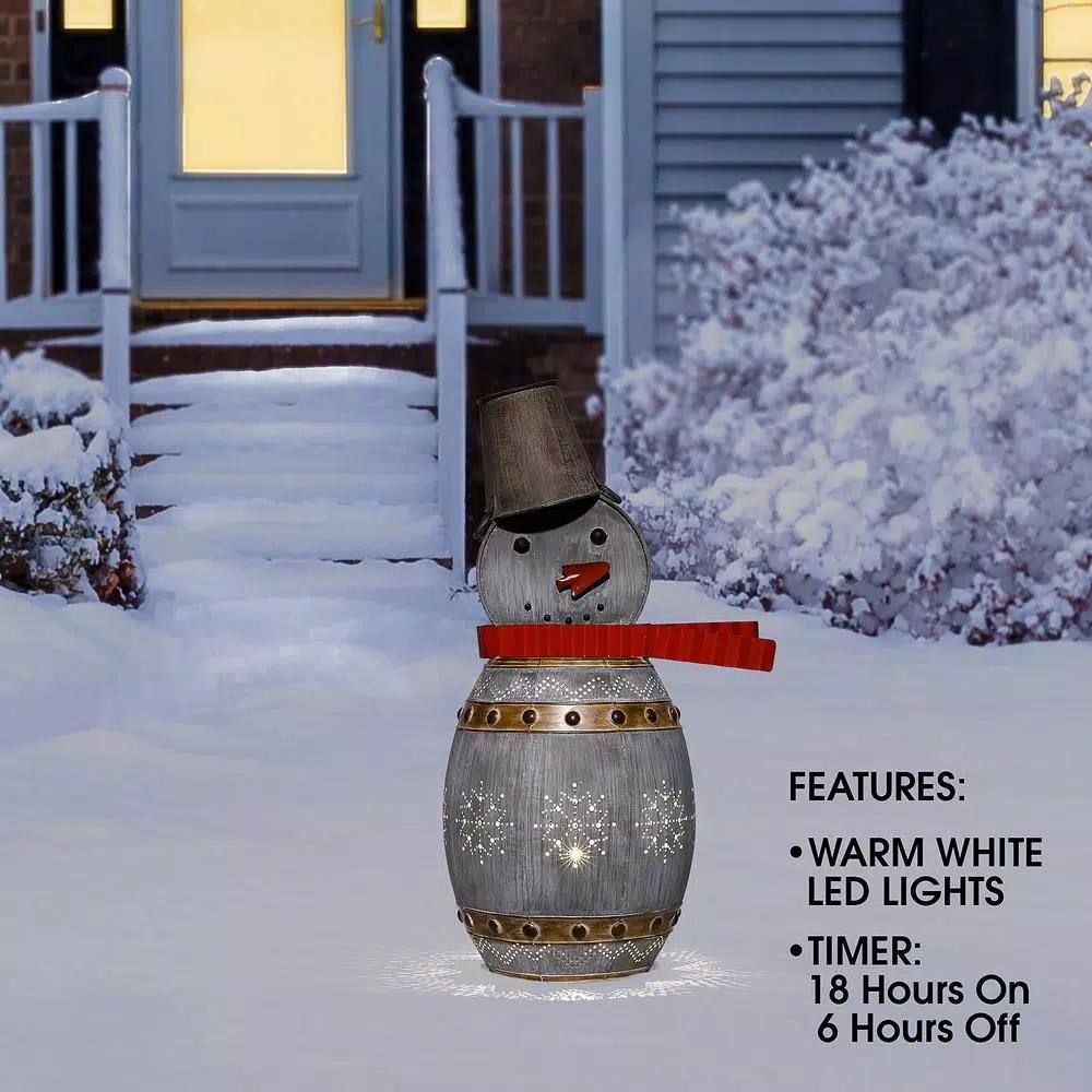 Alpine Corporation 30 in. Weathered Metal Barrel Snowman Sculpture with Warm White LED Lights