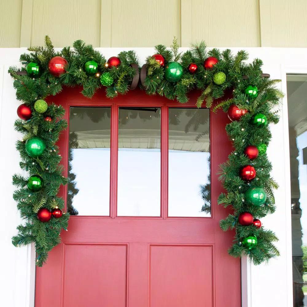 Village Lighting Company 9 ft. Pre-Lit LED Christmas Cheer Garland with Red and Green Ornaments