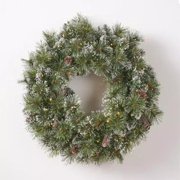 Noble House 24 in. Pre-Lit LED Artificial Christmas Wreath with Flocked Snow, Glitter, and Pinecones