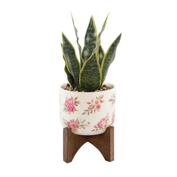 Flora Bunda 12 in. Faux Snake Plant in Floral White Ceramic Pot with Wood Stand