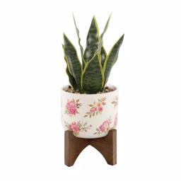 Flora Bunda 12 in. Faux Snake Plant in Floral White Ceramic Pot with Wood Stand thumbnail 1